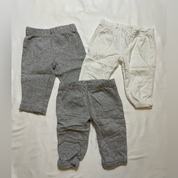 Girls Carter’s size newborn 3 pants, 2 sleep sacks, 1 shirt, and 1 onsie set. - Picture 8 of 11